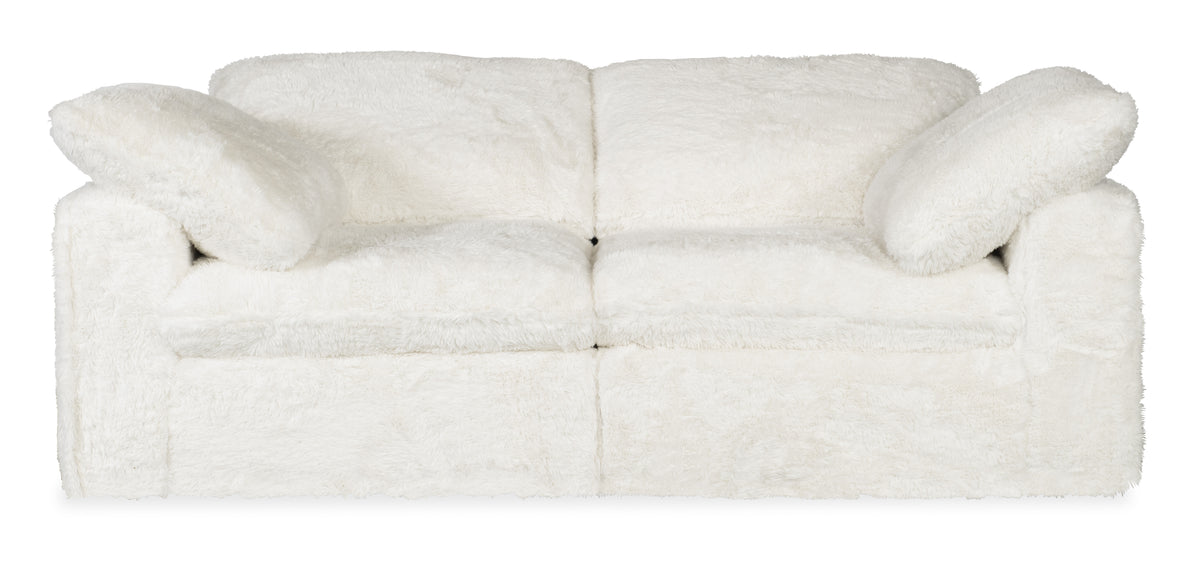 a white couch with pillows