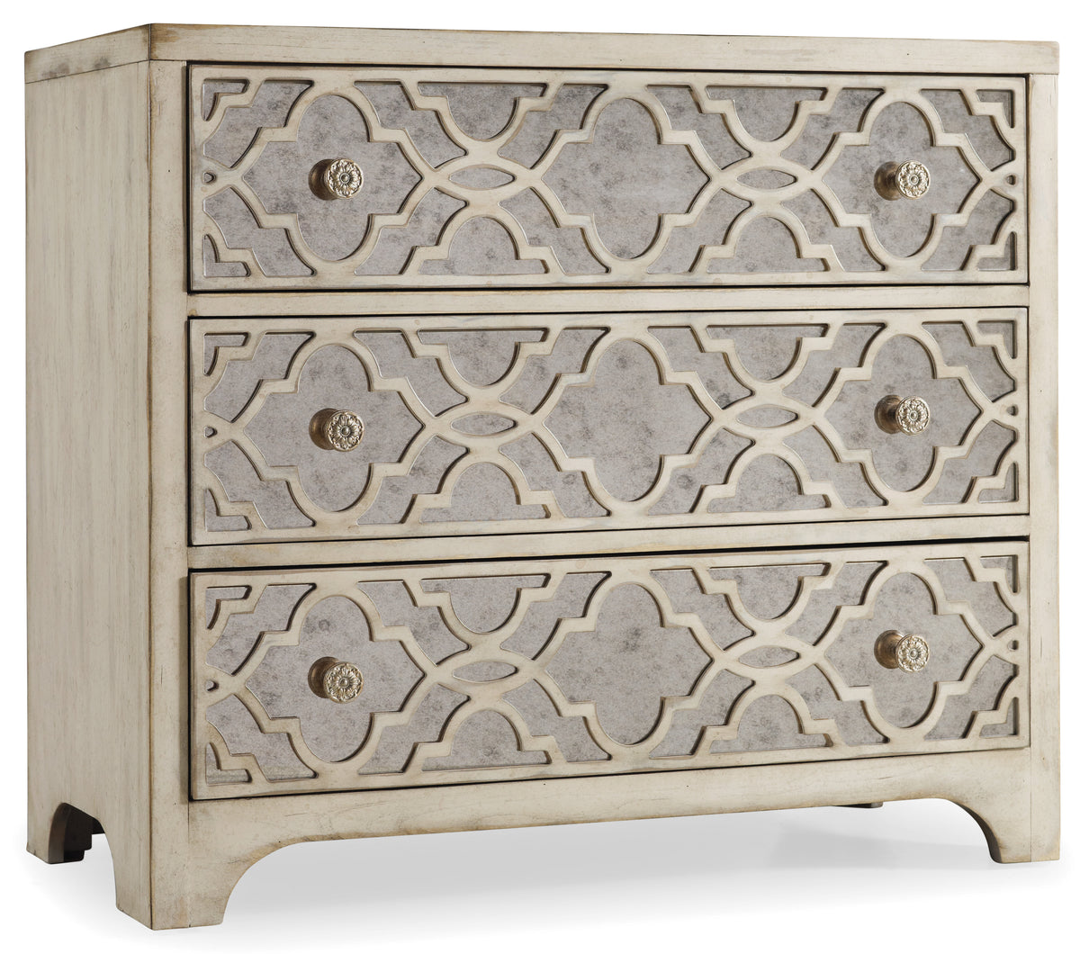 a white dresser with a pattern on it