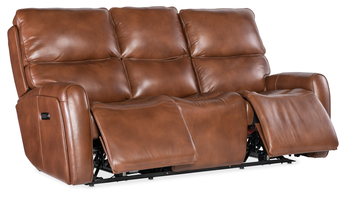 a brown leather couch with armrests