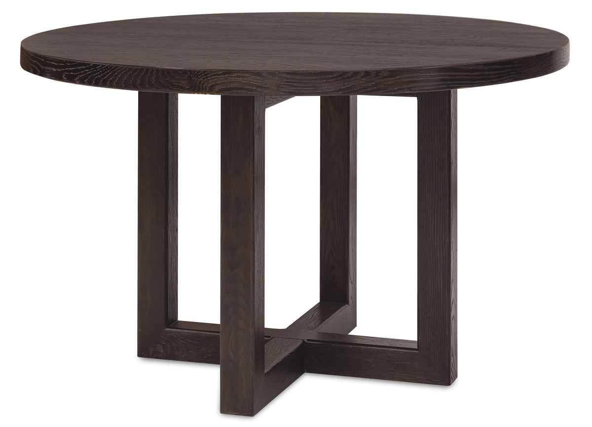 a round wooden table with four legs