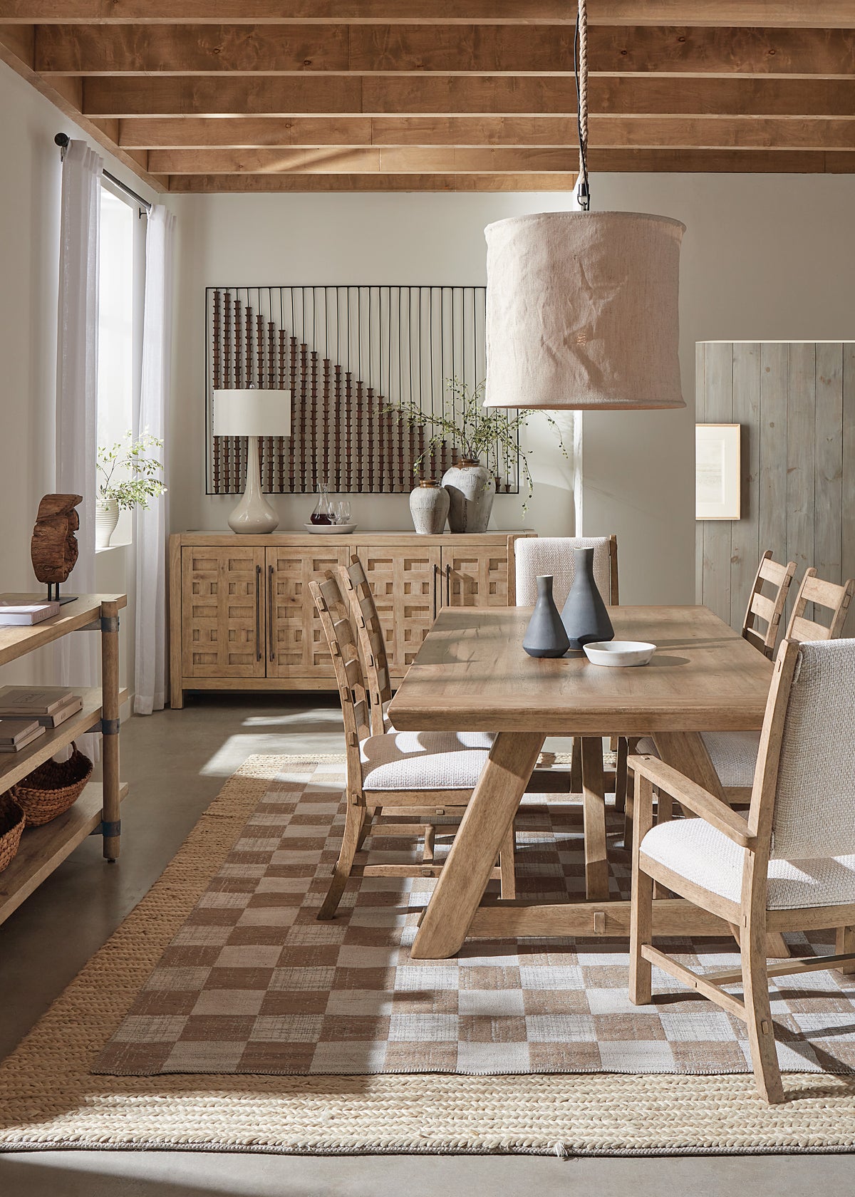 a dining room with a table and chairs