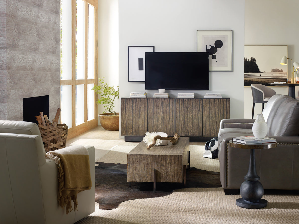 a living room with a television and a fireplace