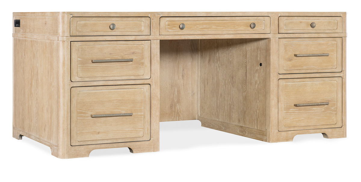 a wooden desk with drawers