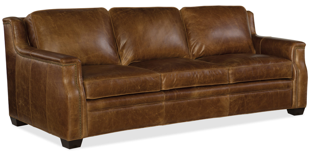a brown leather couch with a white background