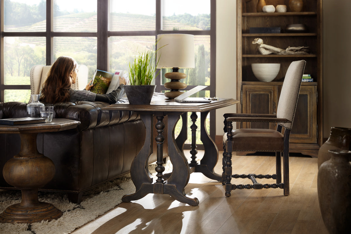 a woman reading a book in a living room