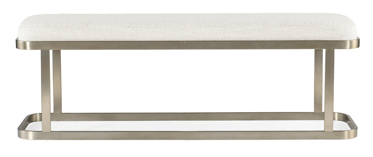 a white bench with a white cushion