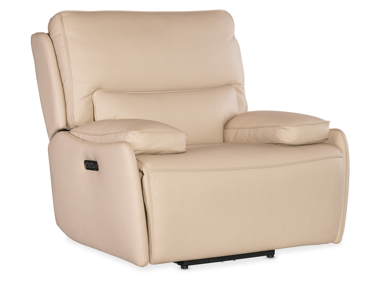 a white recliner with a pillow