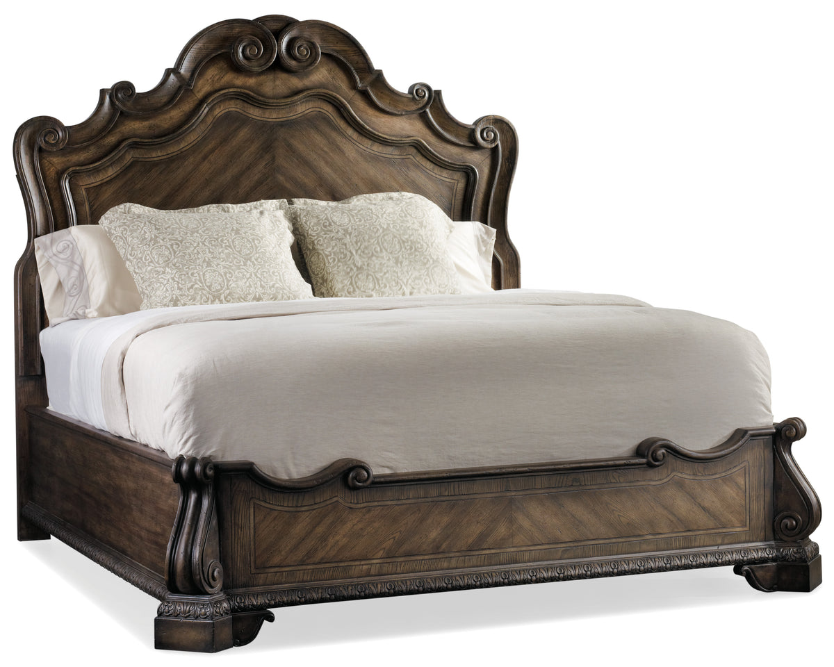 a bed with white sheets and pillows