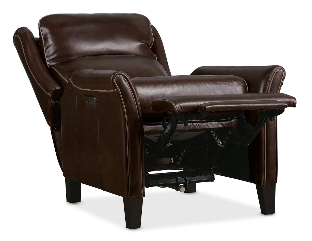 a brown leather recliner with a table