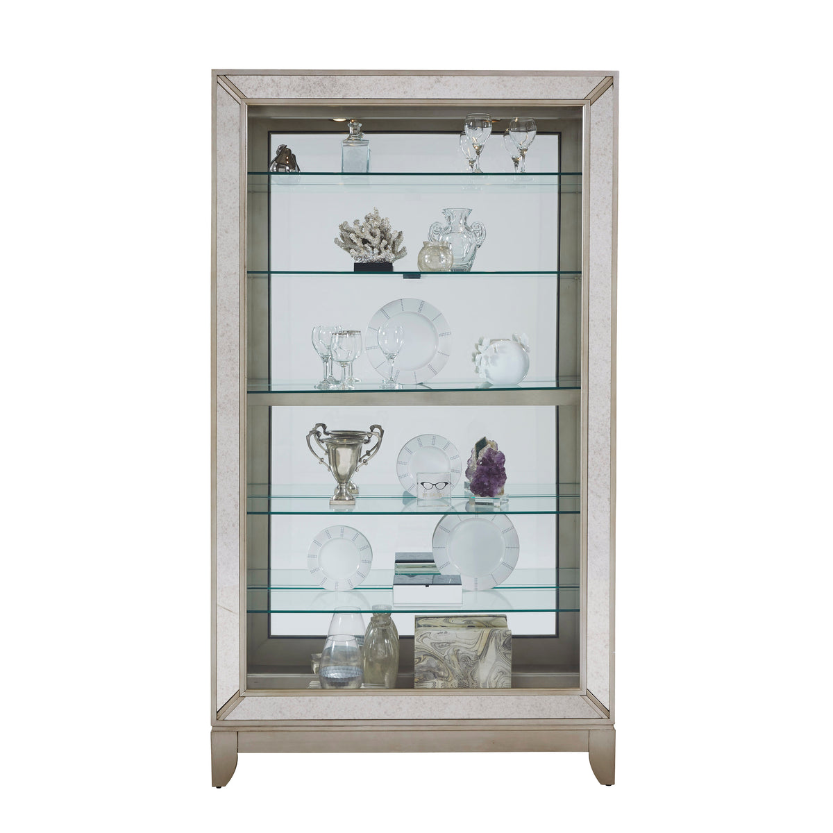 a glass cabinet with various objects on it