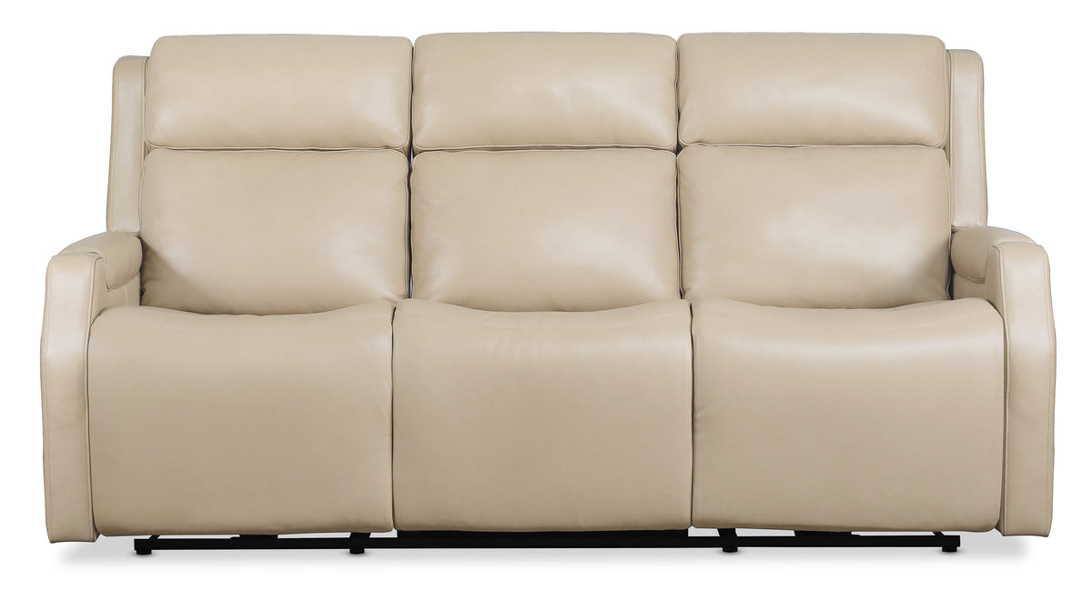 a white leather couch with black legs