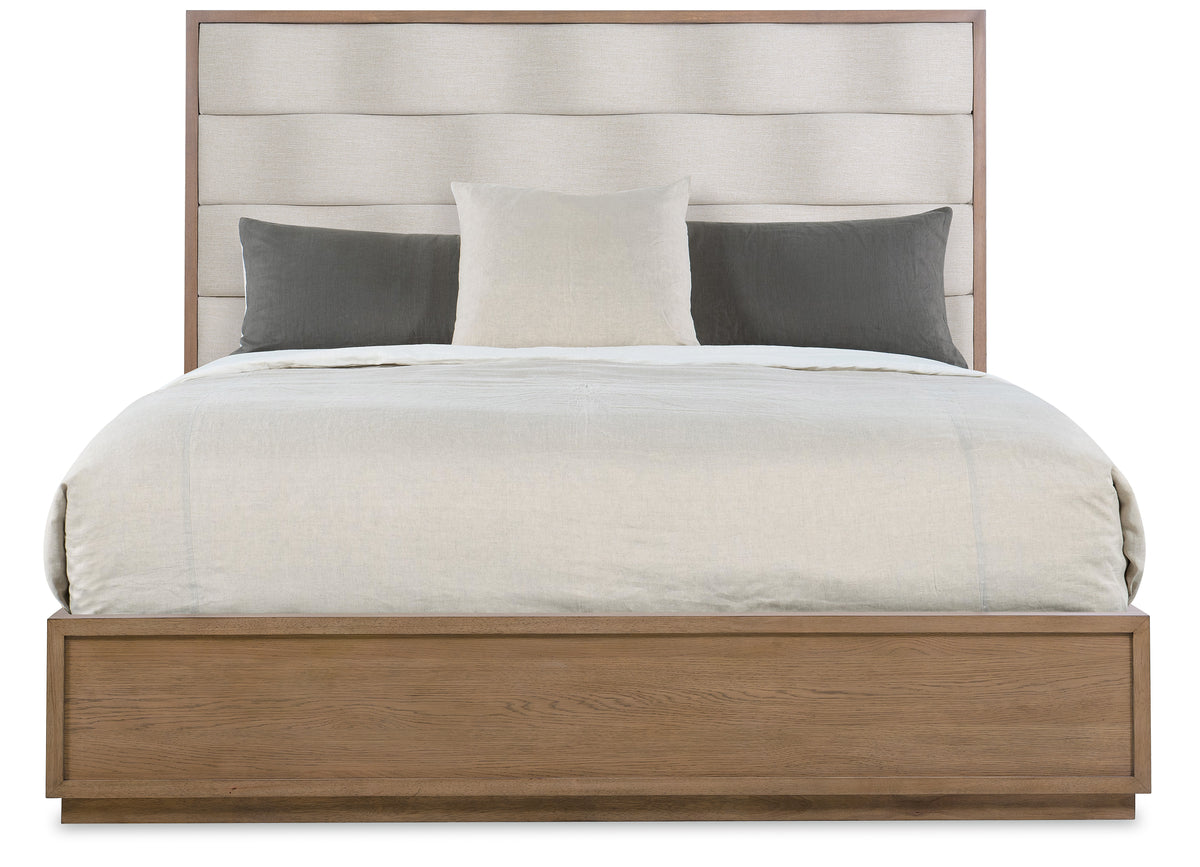 a bed with a white bedding and pillows