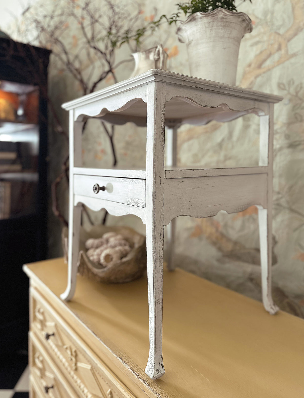 a white table on a dresser