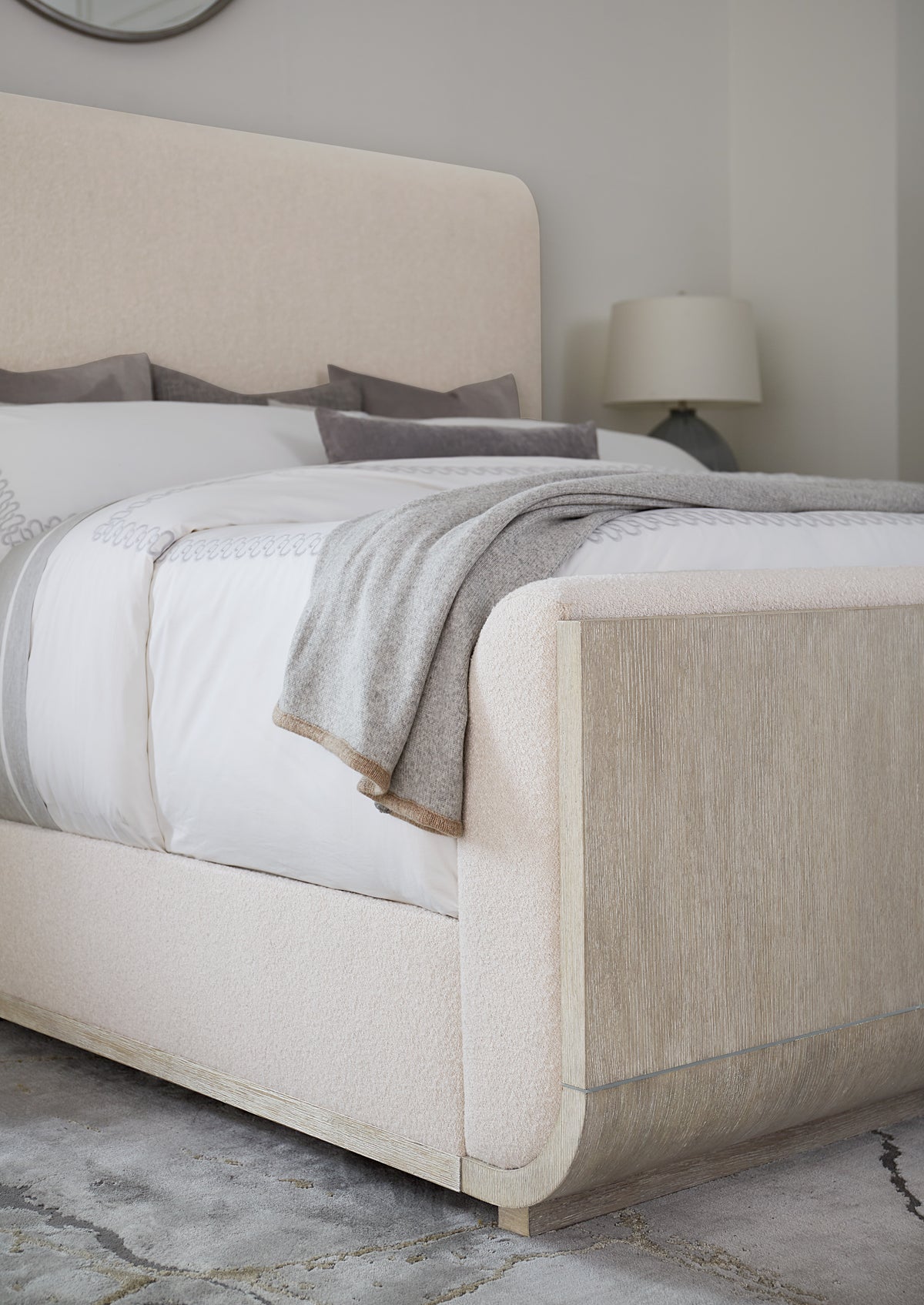 a bed with a white headboard