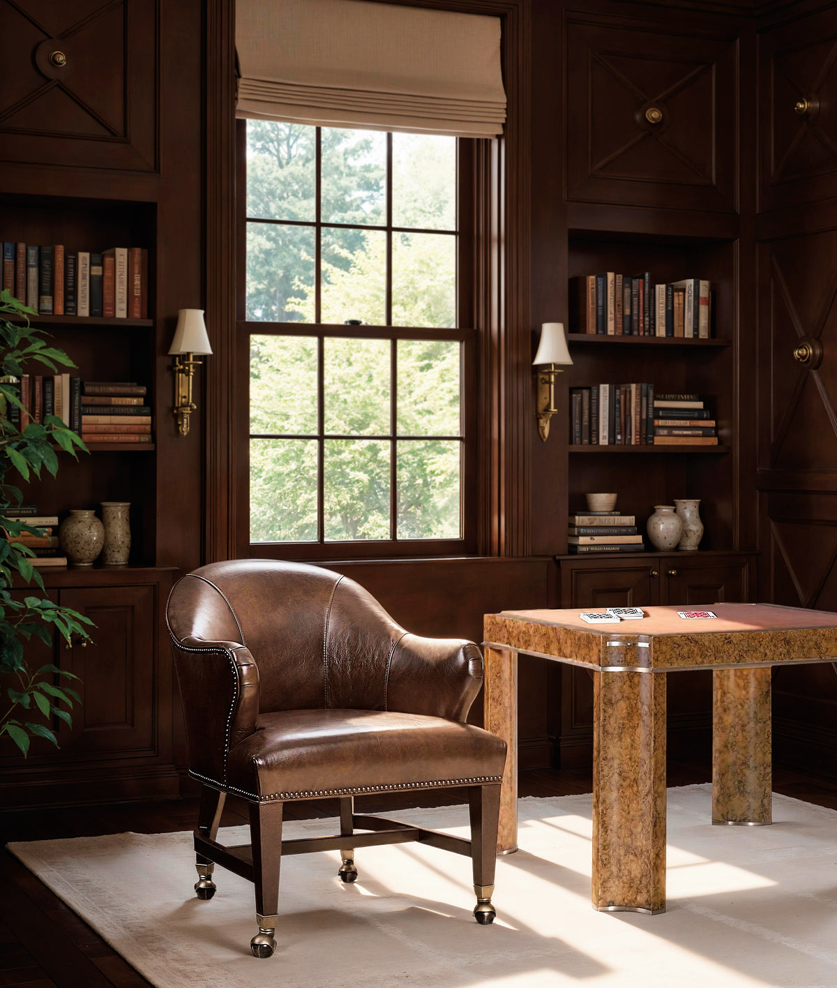 a chair in a room with a table and bookshelves