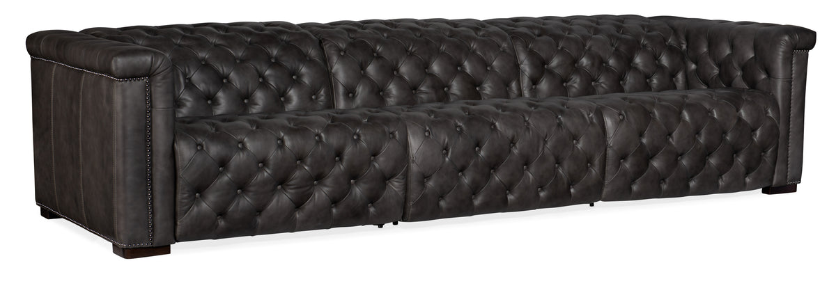 a black leather couch with buttons