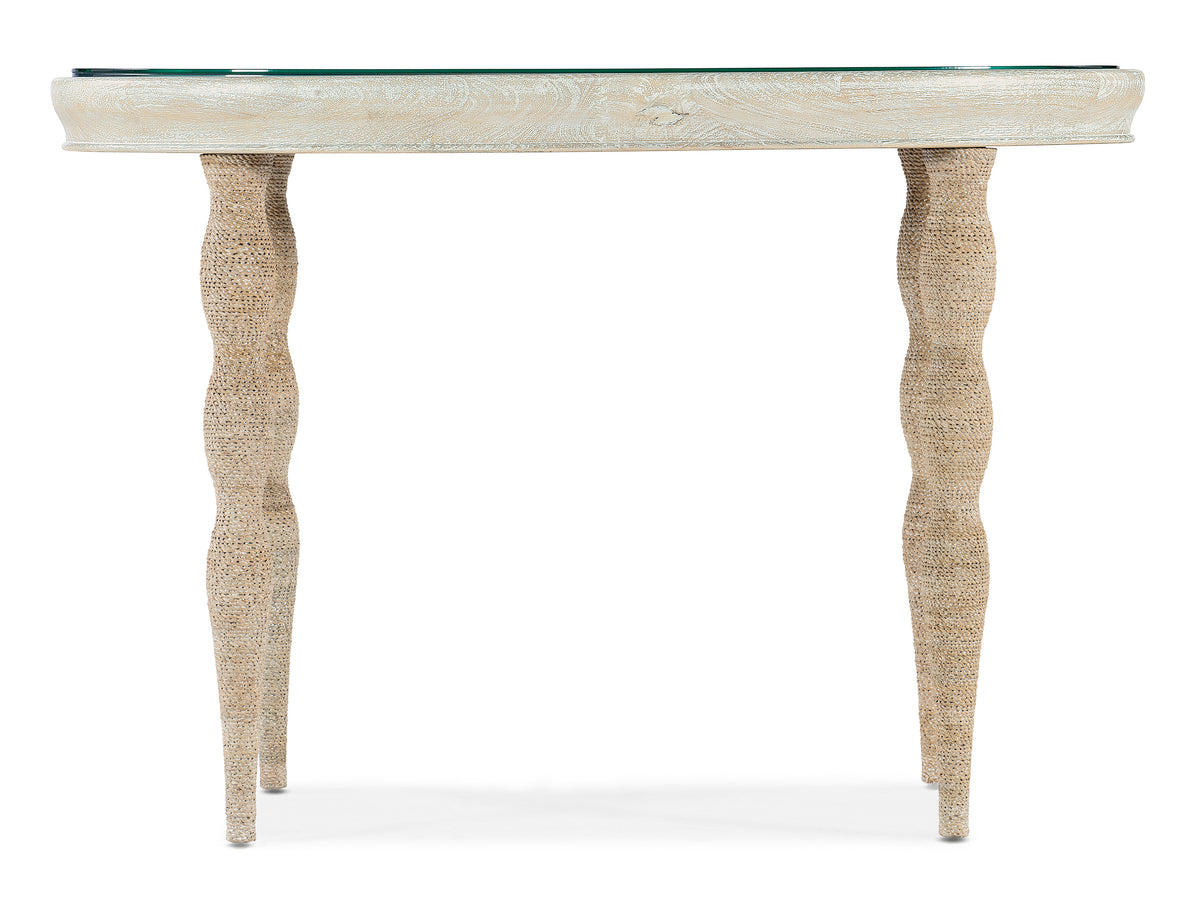 a table with legs and a glass top