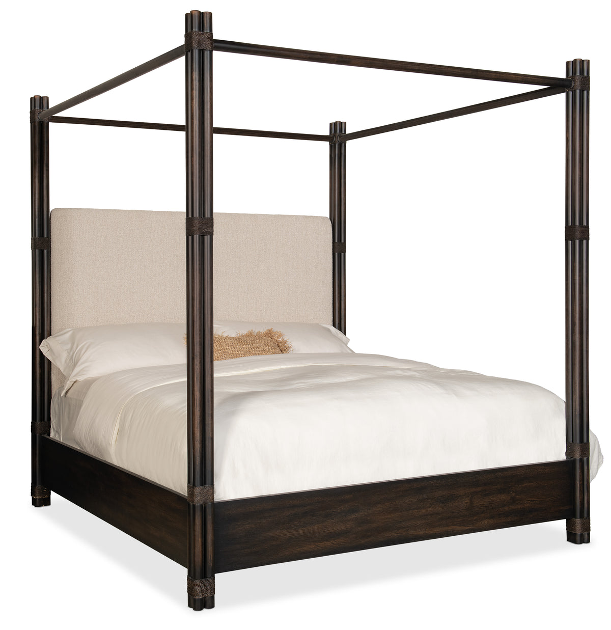 a bed with a white sheet and a white pillow