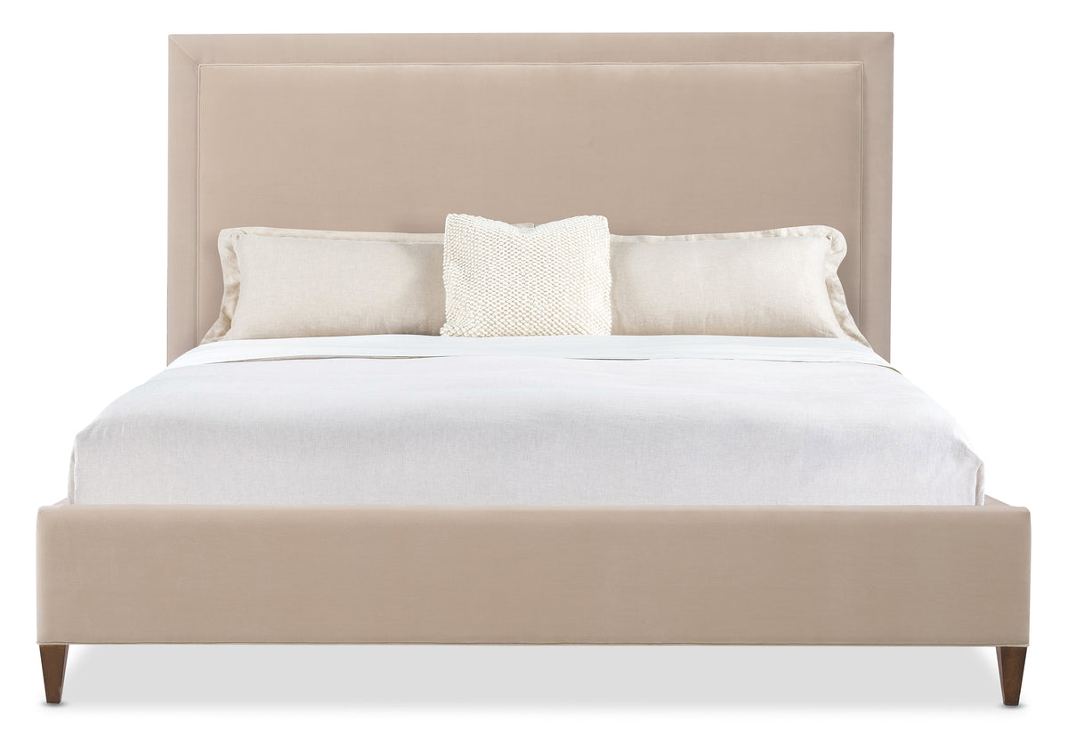 a bed with a white pillow