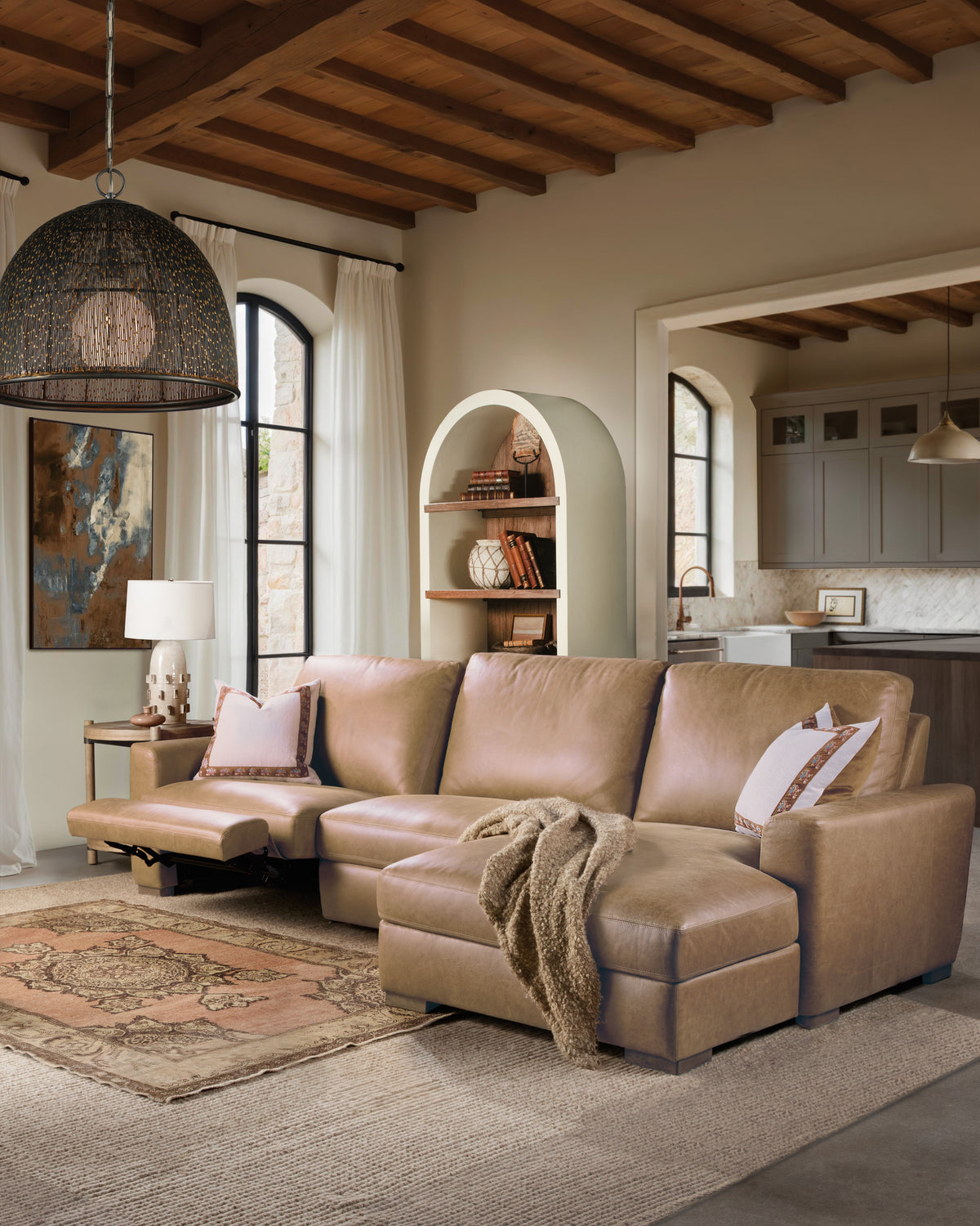 a living room with a couch and a rug