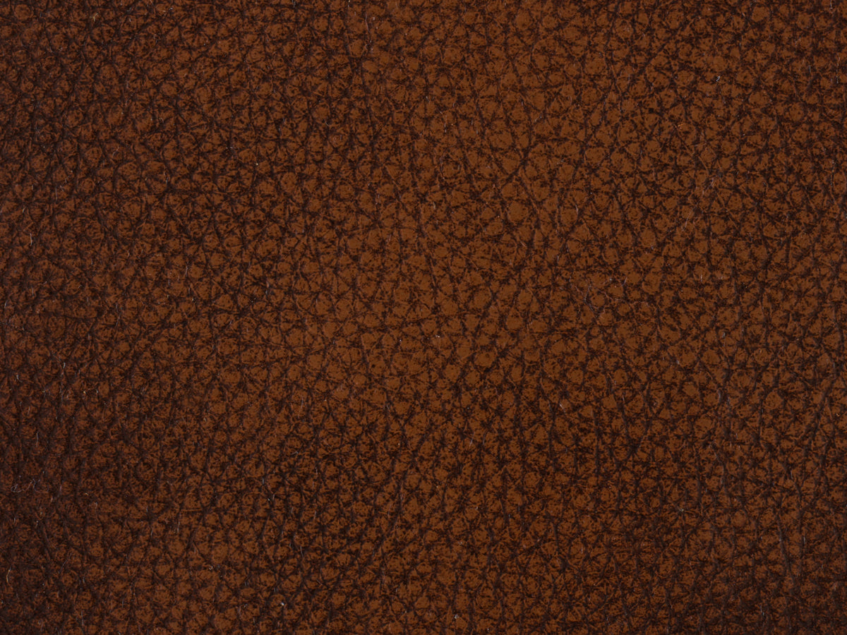 a brown leather surface with black lines