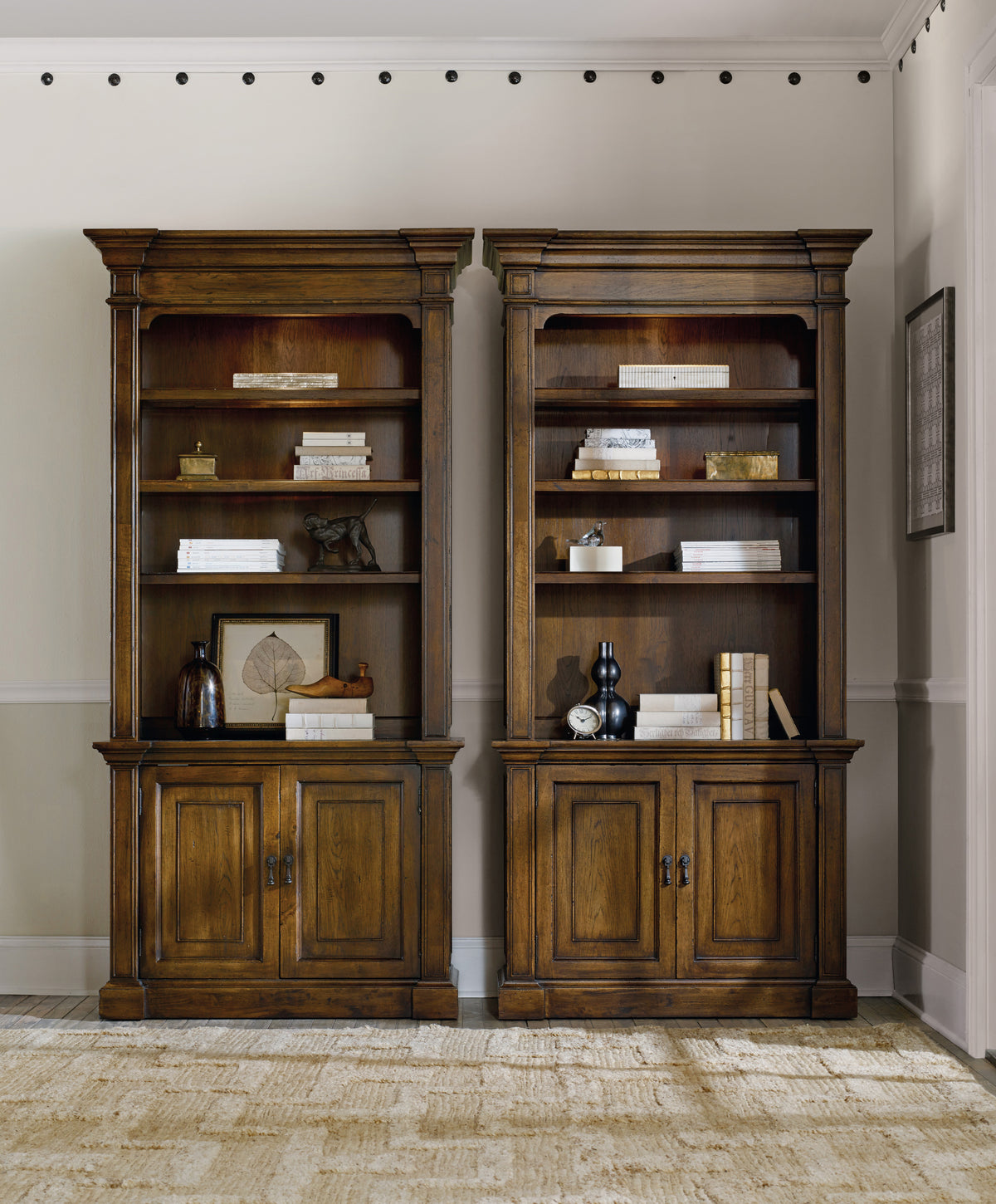 two wooden bookshelves in a room