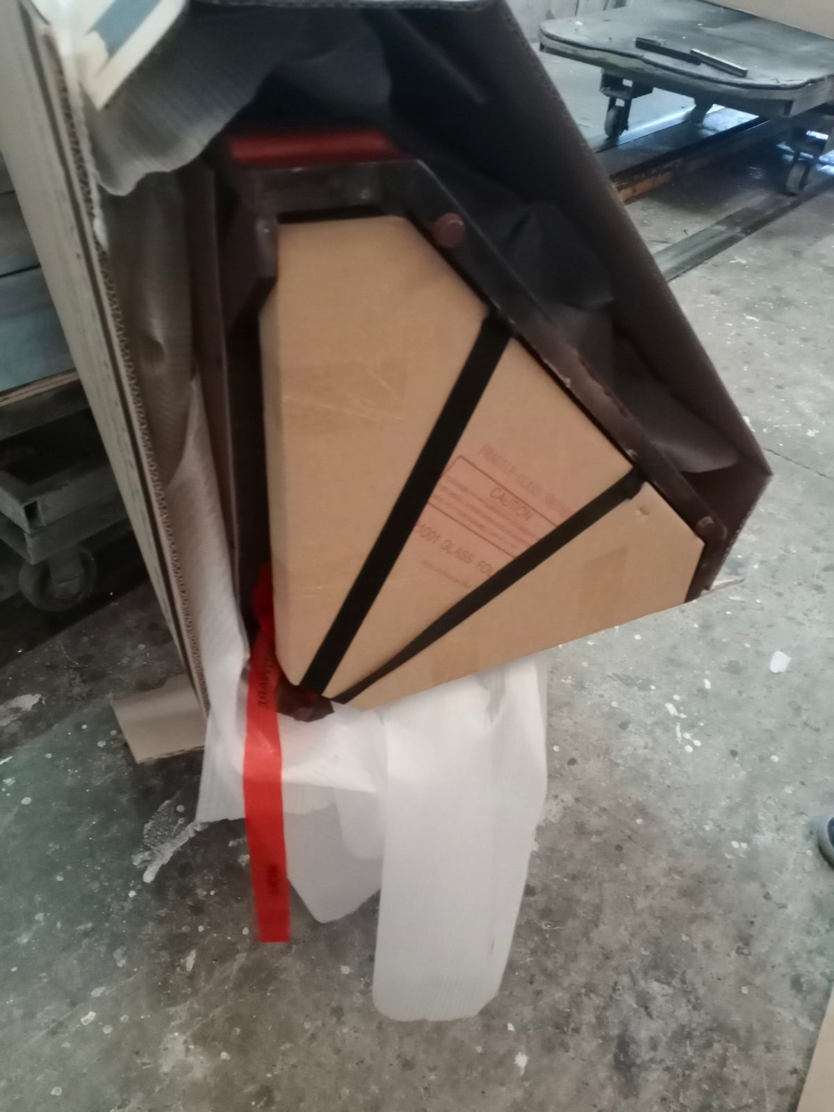 a box with a red ribbon