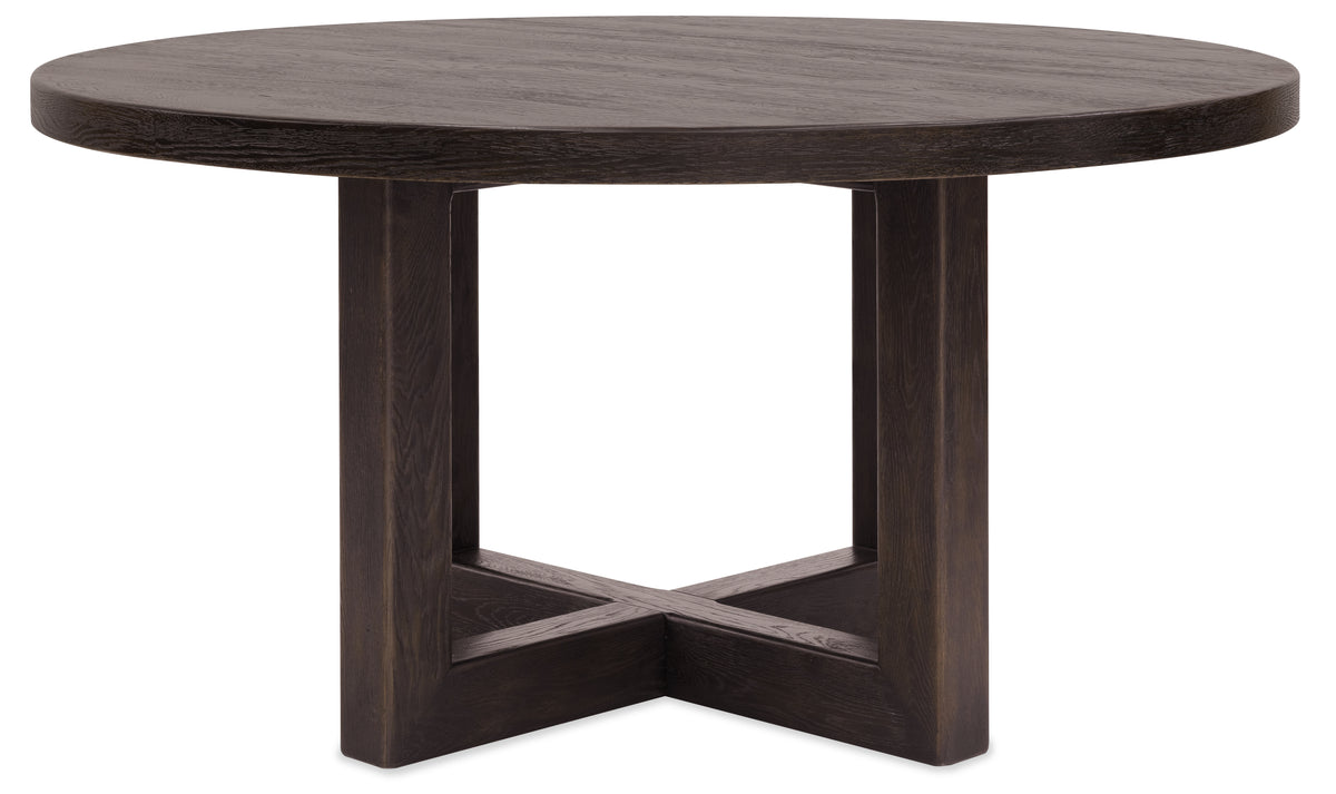 a round wooden table with a cross base