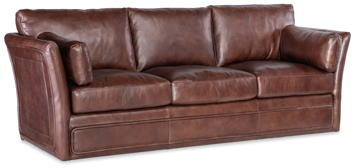 a brown leather couch with a white background