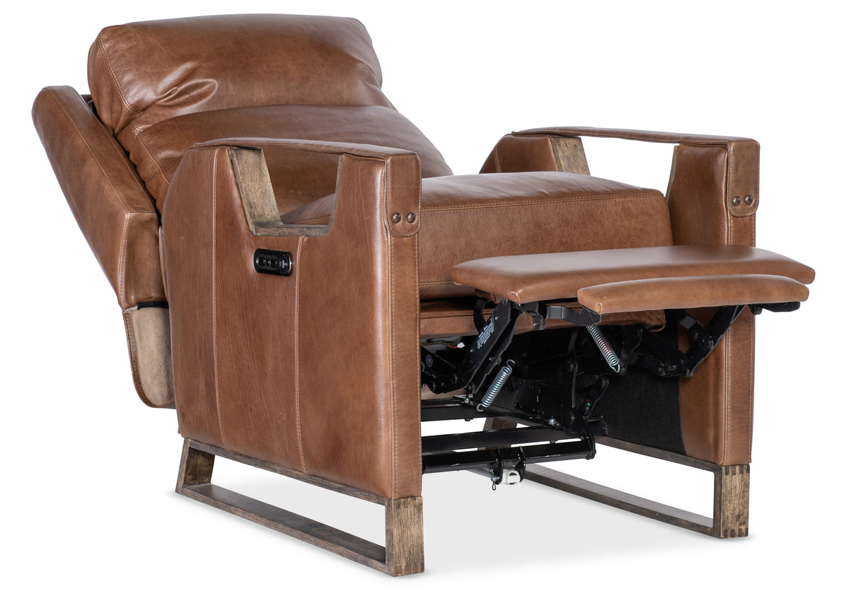 a brown leather recliner chair