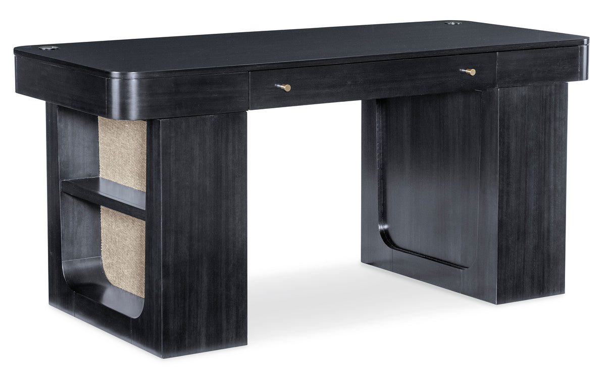 a black desk with a tan speaker