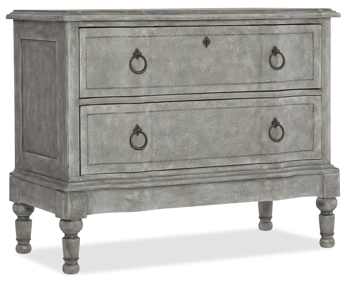 a grey dresser with metal handles
