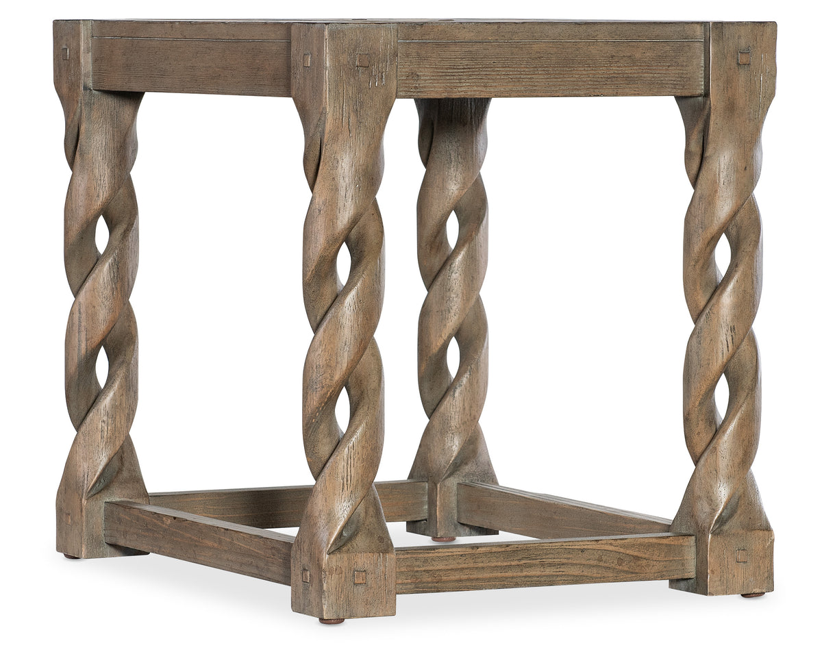 a wooden table with twisted legs