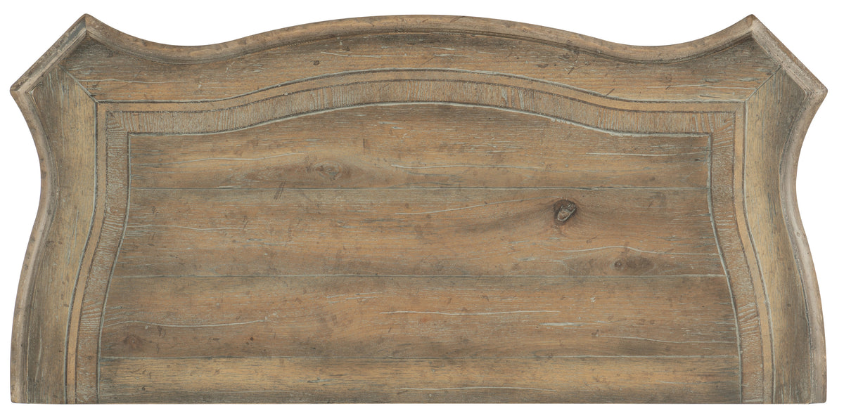 a wooden sign with a curved edge