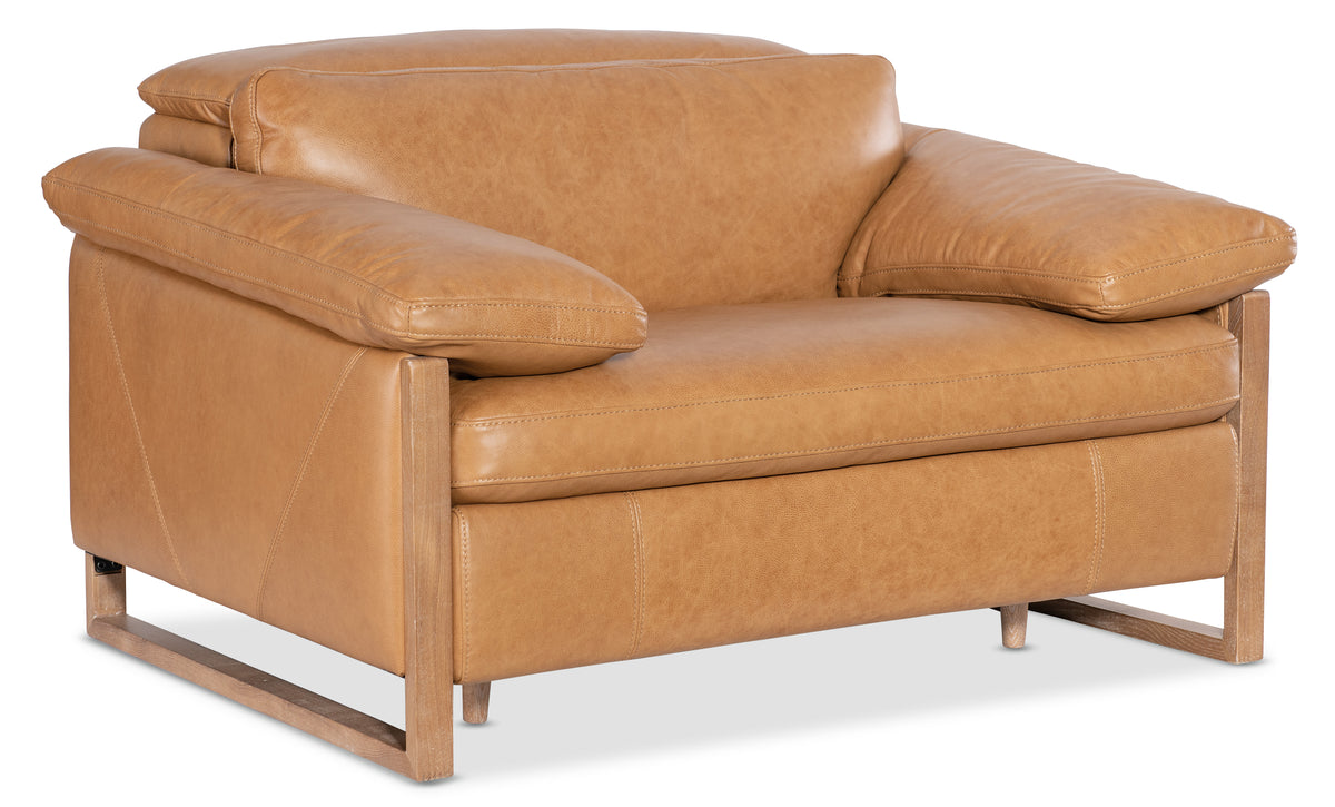 a brown leather chair with wooden legs