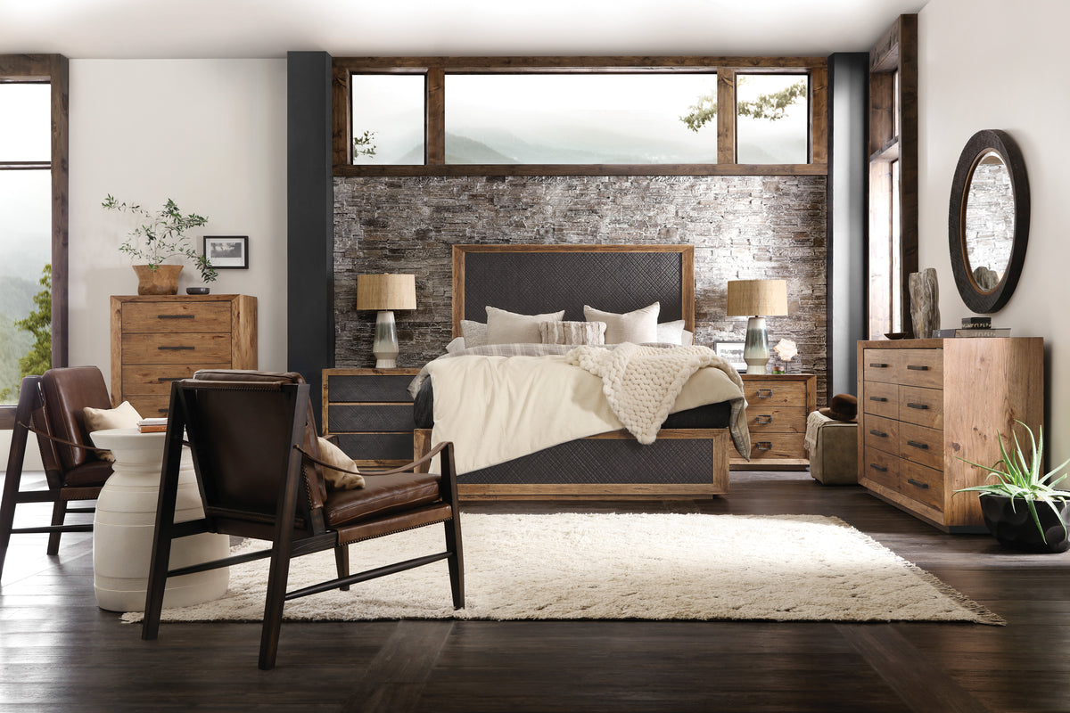 a bedroom with a bed and a chair