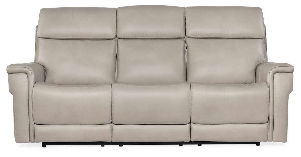 a white couch with four reclining seats