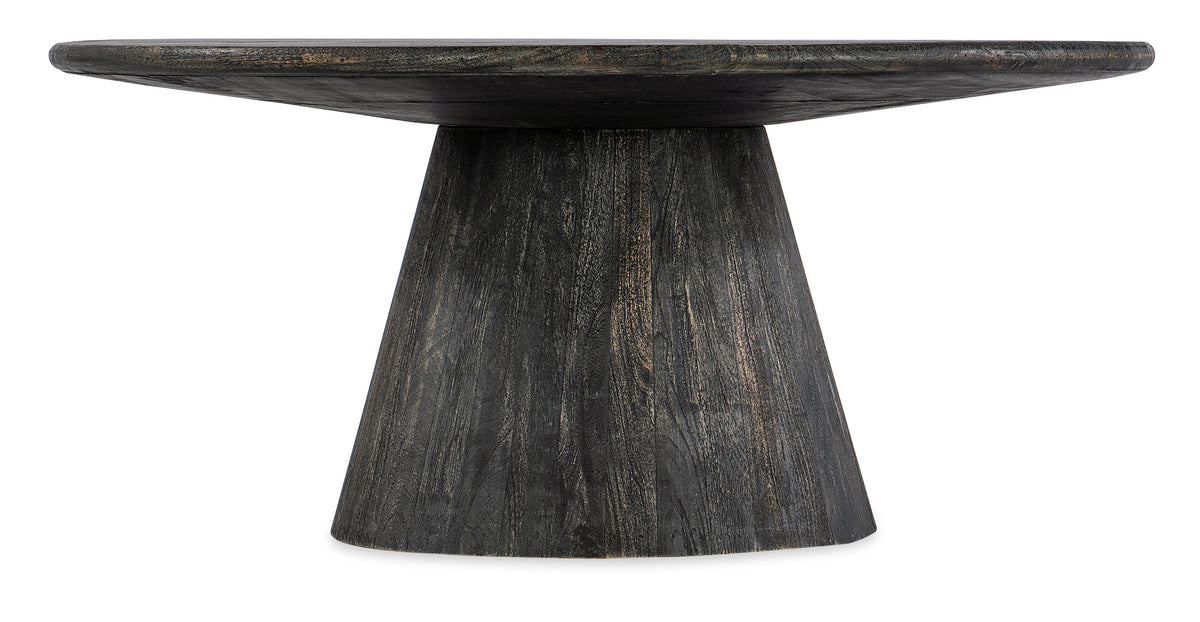 a round wooden table with a round base