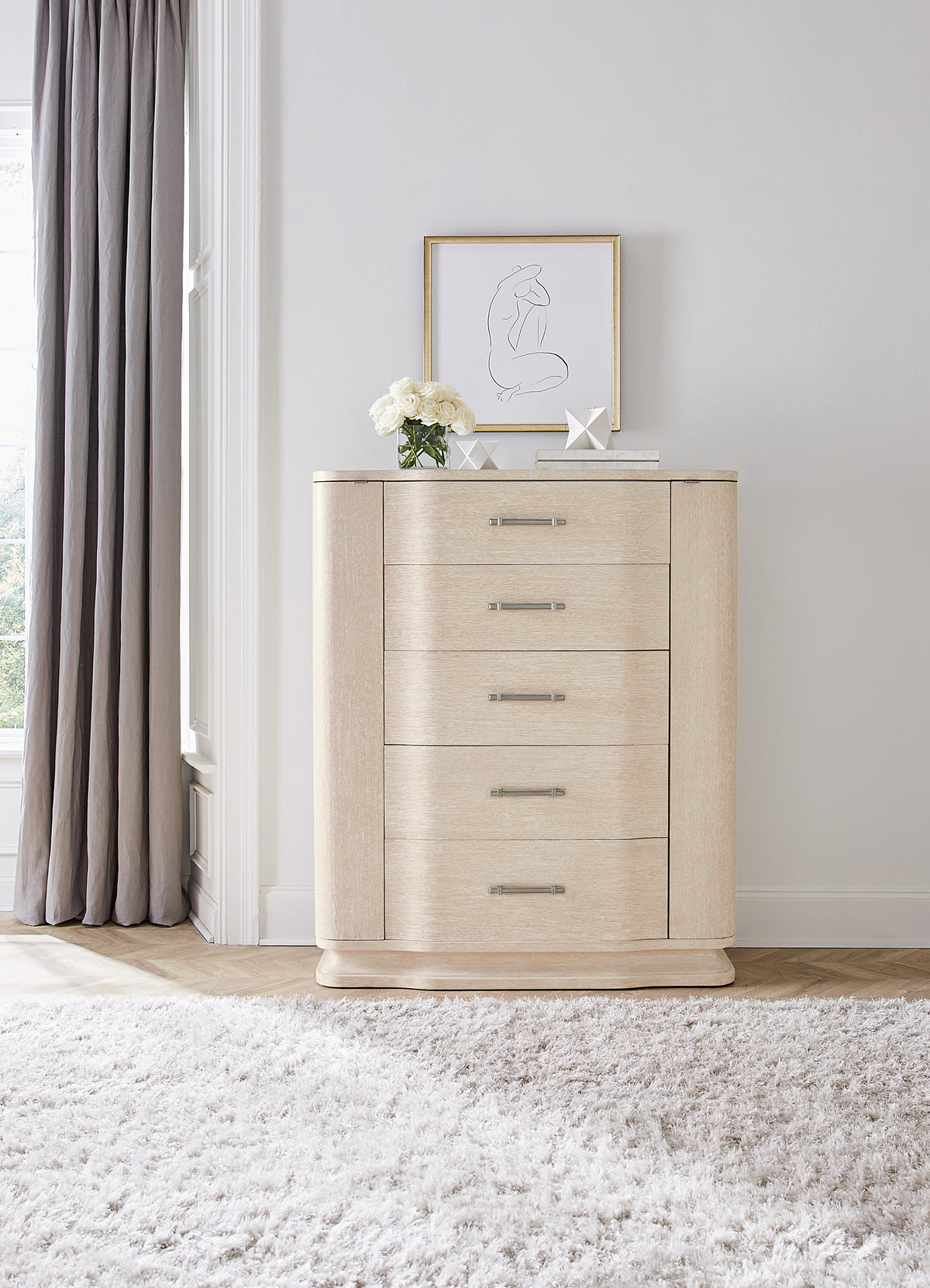 a dresser with a picture on top