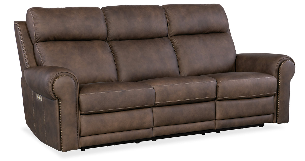 a brown couch with white stitching