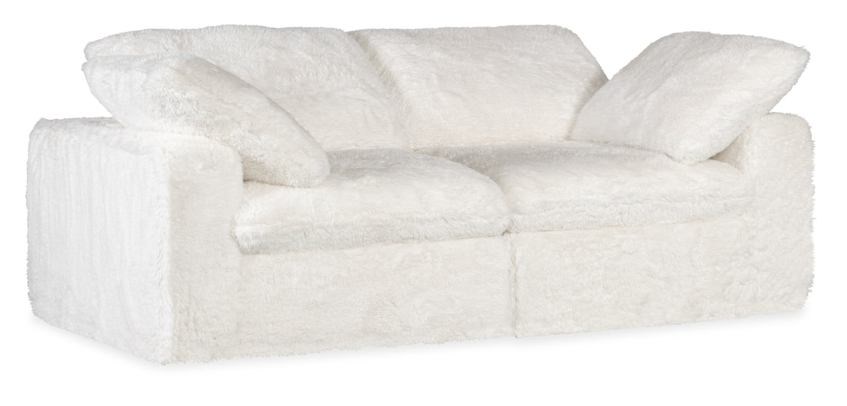 a white couch with pillows