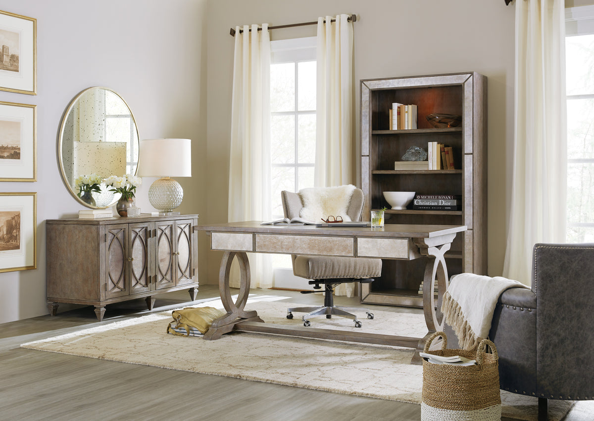 a room with a desk and a bookcase