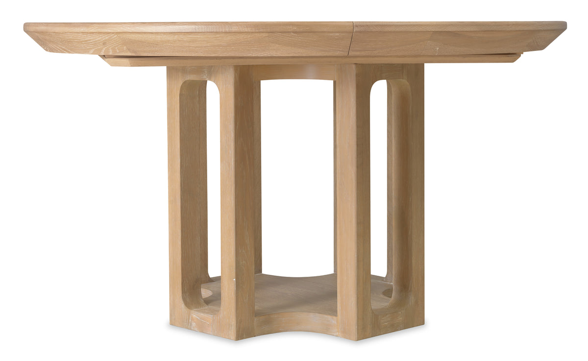 a wooden table with a round top
