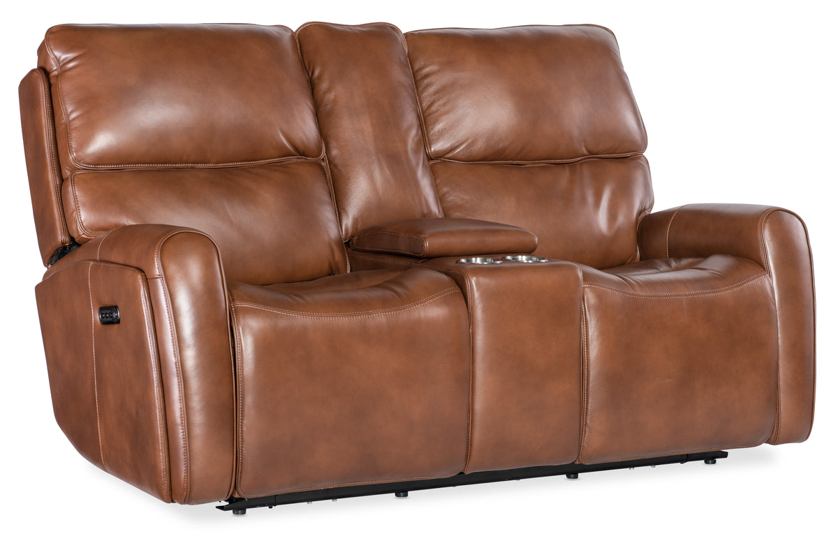 a brown leather couch with armrests