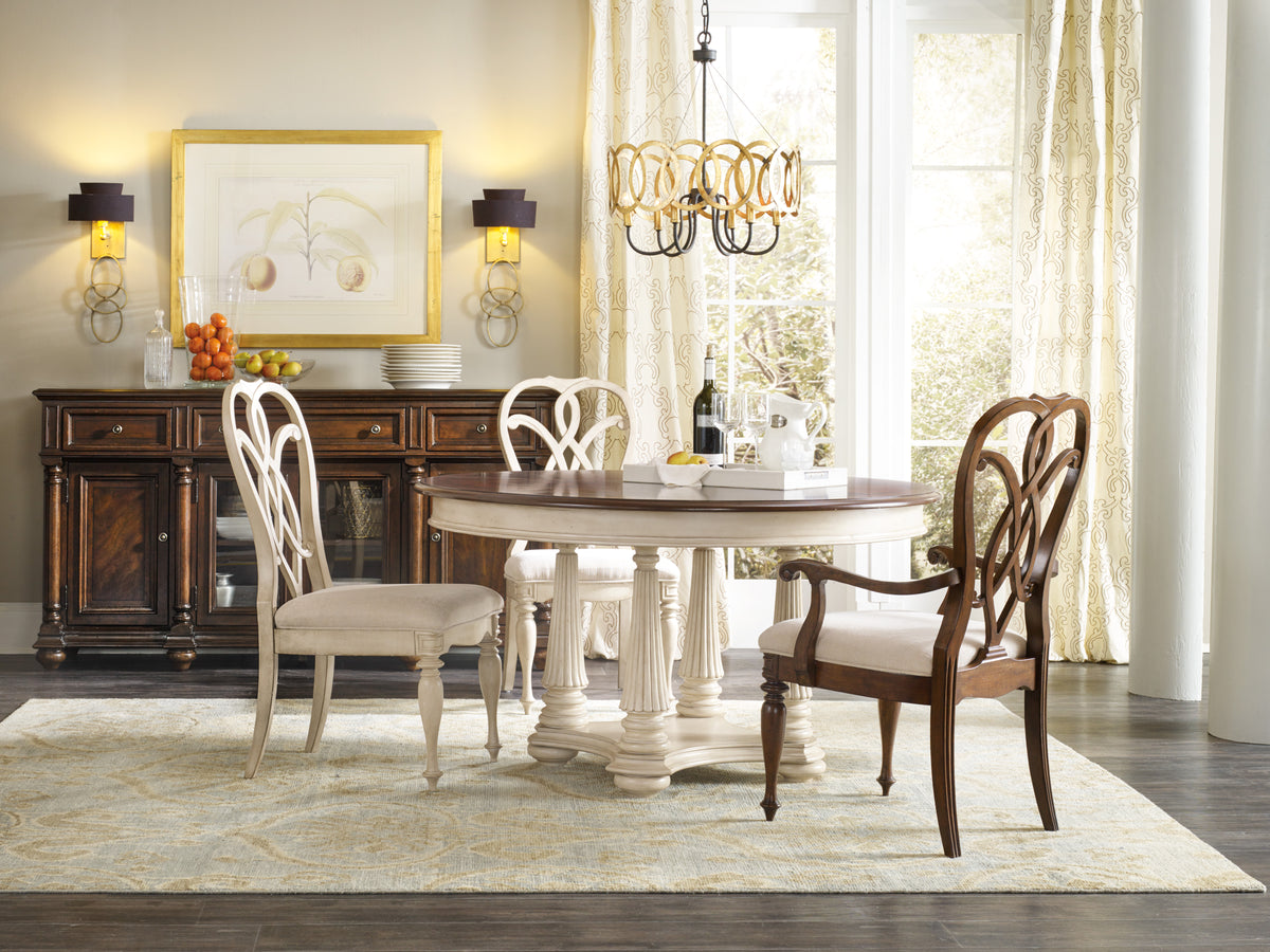 a dining room with a table and chairs