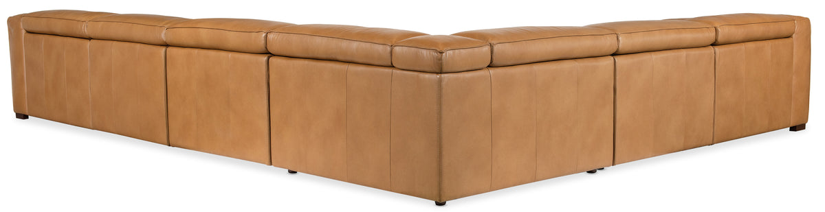 a brown leather corner chair