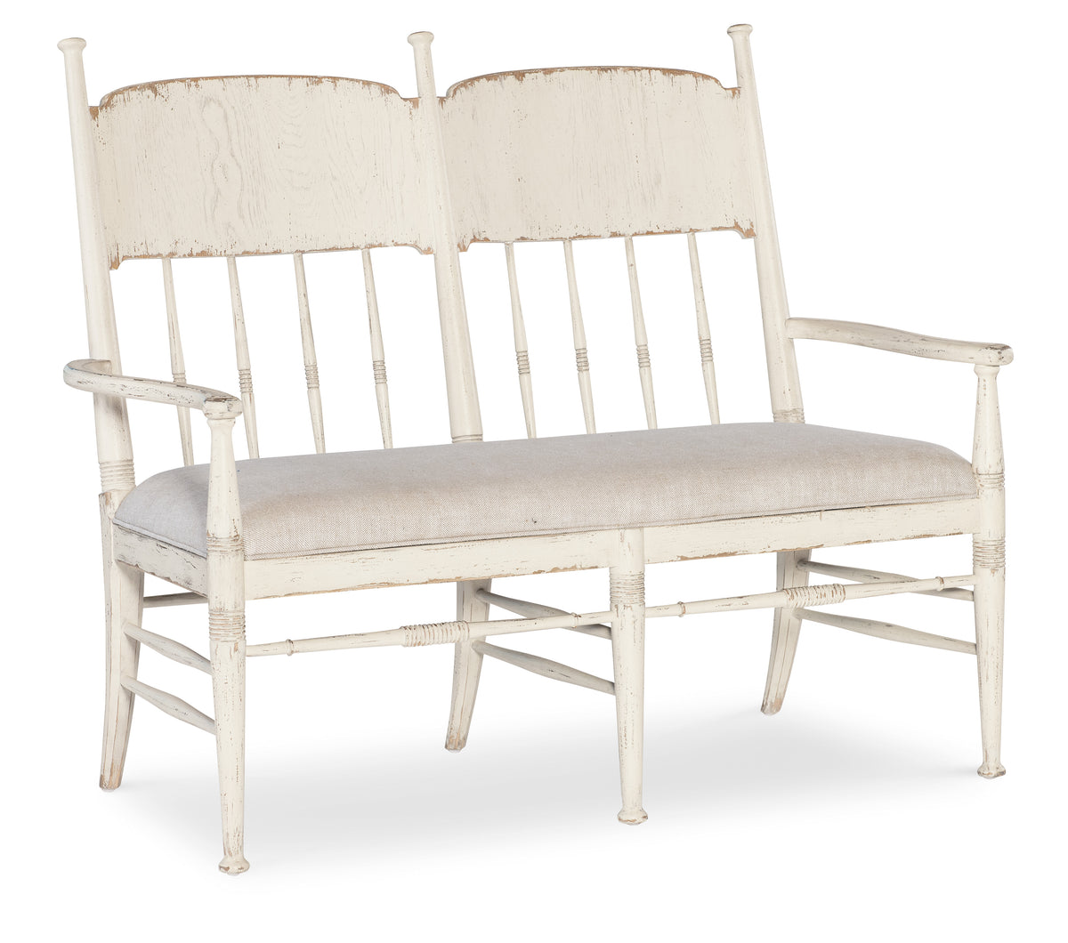 a white bench with two chairs