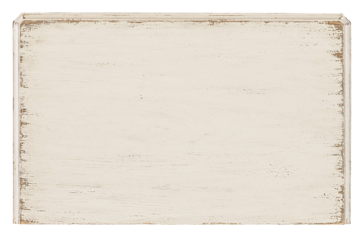 a white rectangular object with brown edges