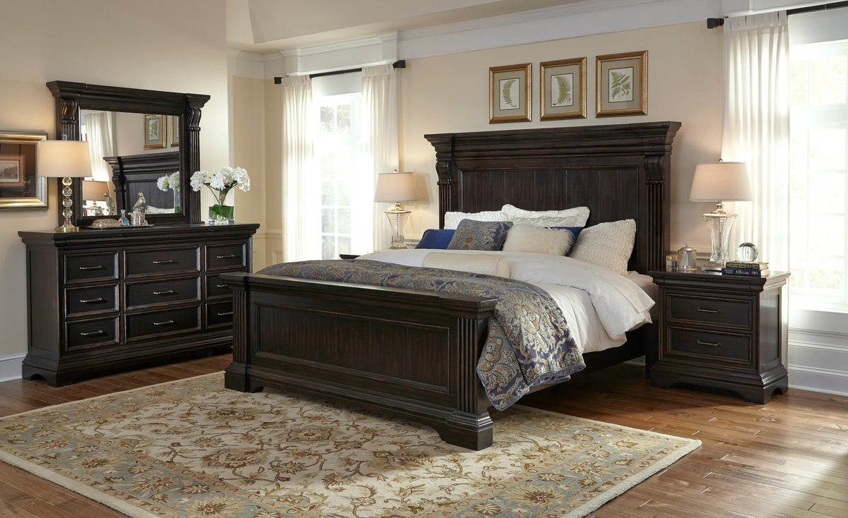 a bedroom with a bed and dresser