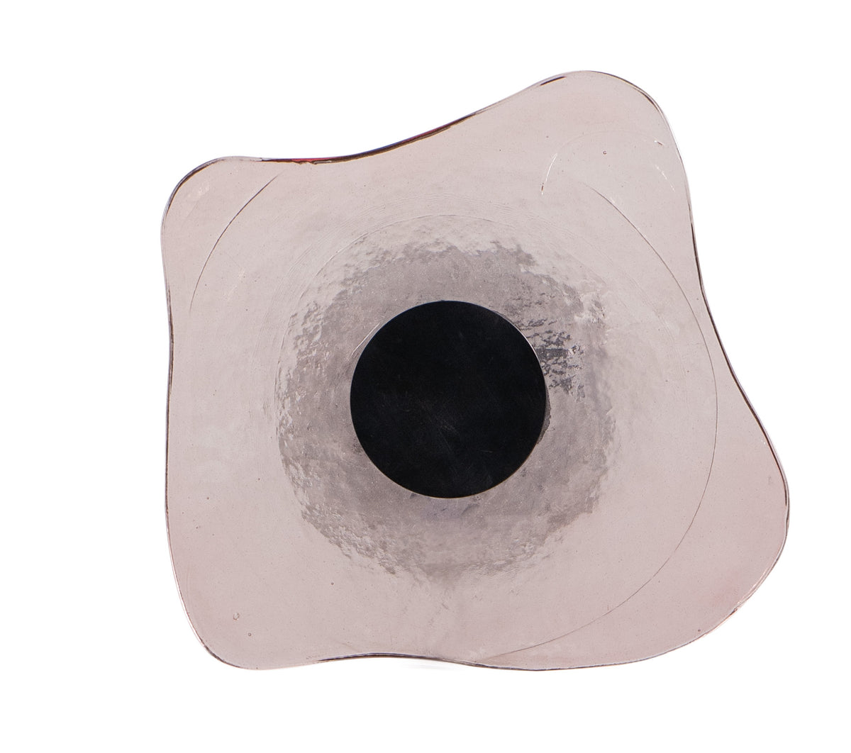 a black circle on a white surface